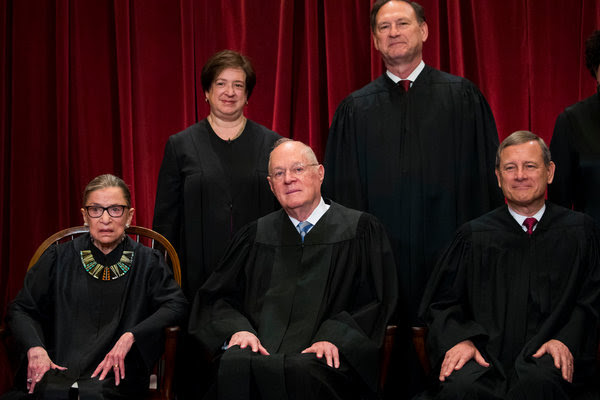 Justice Anthony Kennedy, center, has been a crucial vote on the Supreme Court for decades. He announced his retirement on Wednesday.