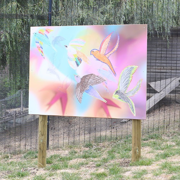 Artwork of birds and flowers in pale blues, pinks and yellow in the Gardens
