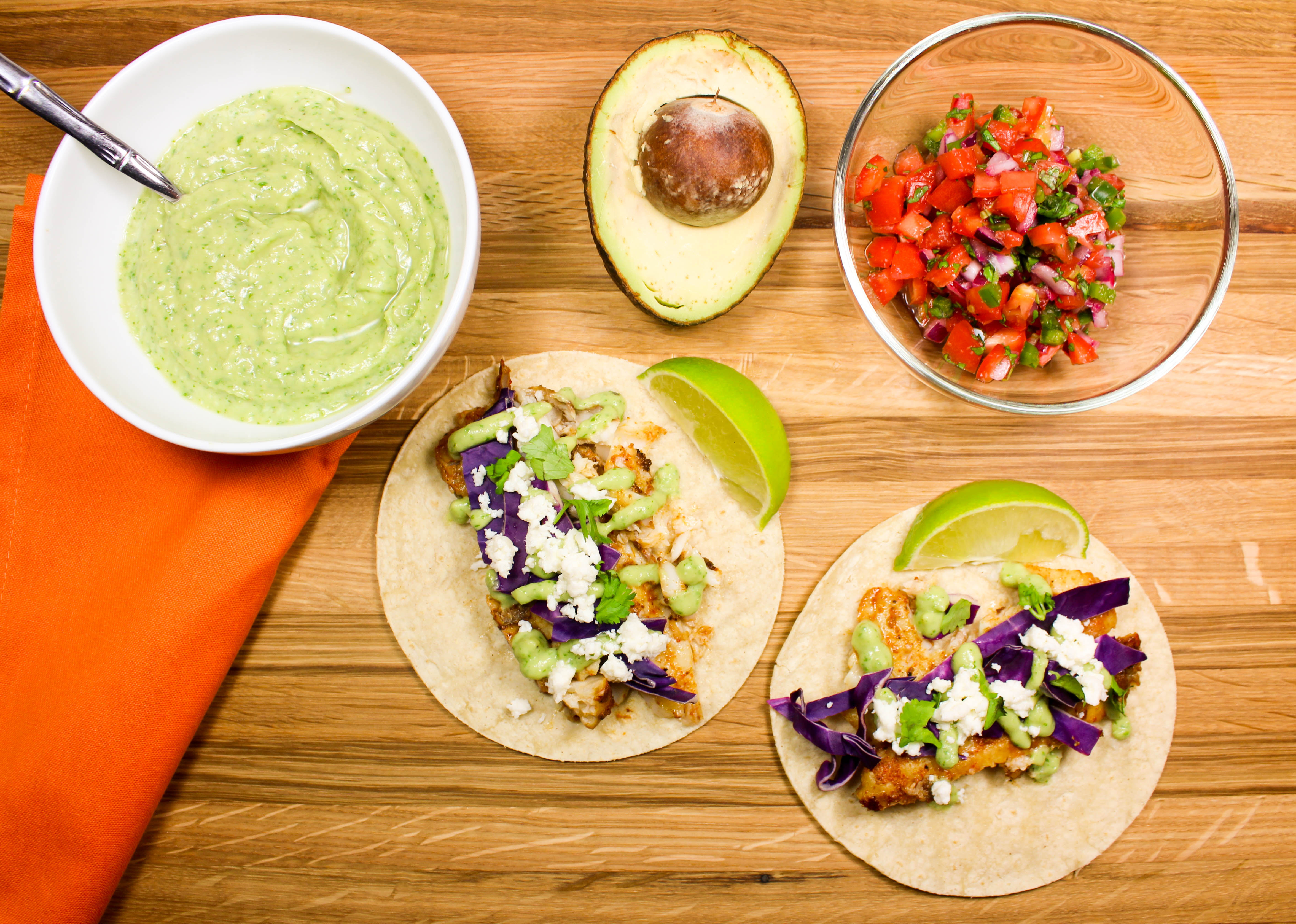 In the bowl of a food processor, blend the garlic and salt until finely chopped. Skillet Fish Tacos With Avocado Crema