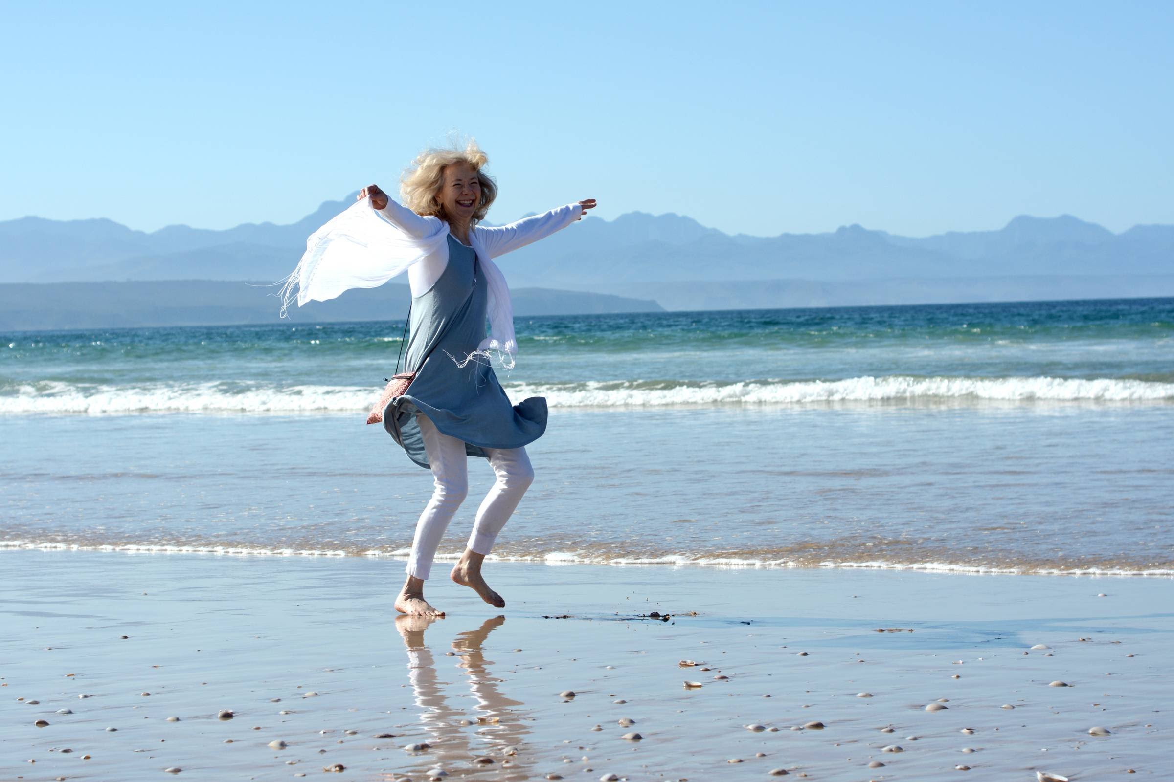 Joy Truscott dancing on the beach 