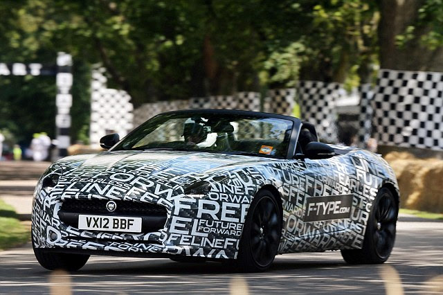Shrouded in secrecy: The new F-type as disguised prototype at Goodwood. The official reveal in Paris next week is heralded as a 'truly significant day' by the motoring giant