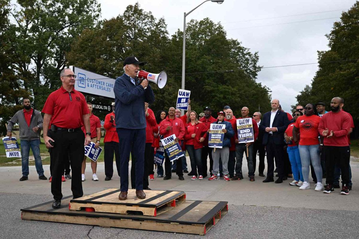 Photo of Jpe Biden with bullhorn talking to UAW strikers.