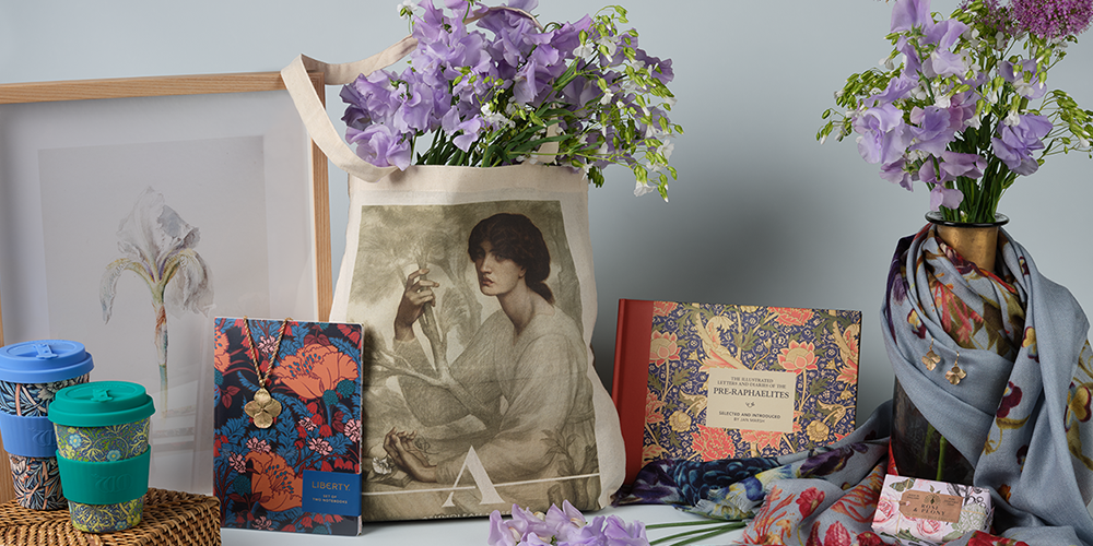 A selection of shop items on display alongside purple flowers