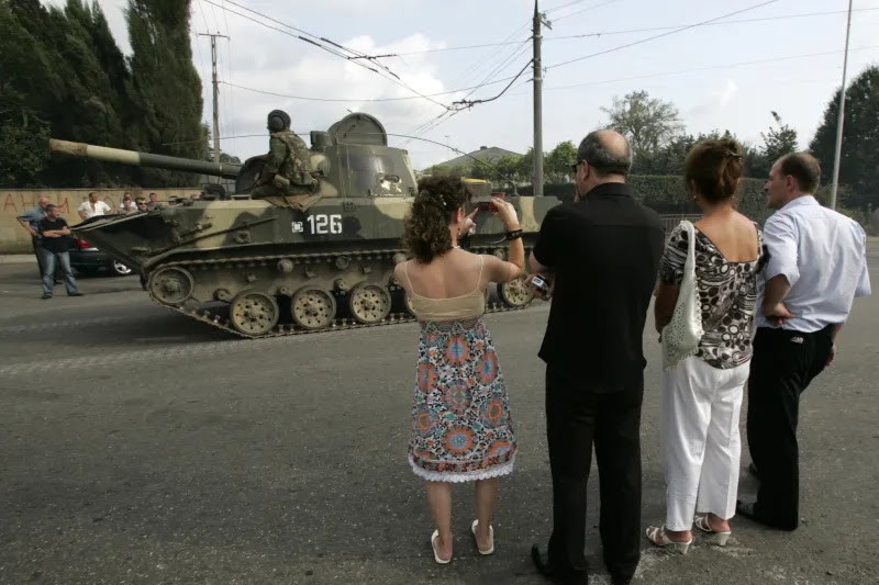 Civilians watching a Russian military convoy, Zugdidi, Georgia, August 2008
