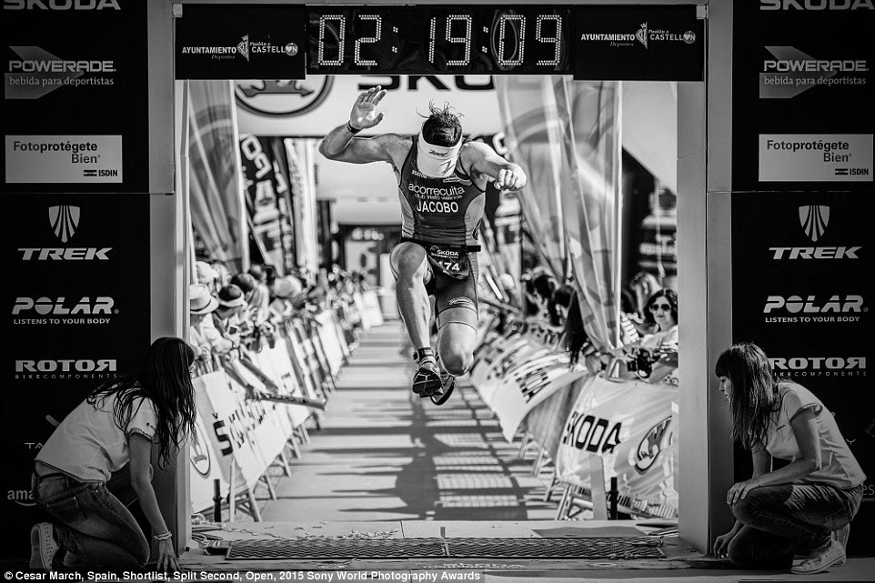 Competition: A triathlete leaps over the finish line of a race in this photo submitted by Cesar March of Spain to the Split Second category