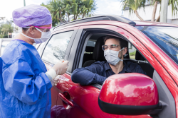 photo of a person in a car getting tested for COVID-19