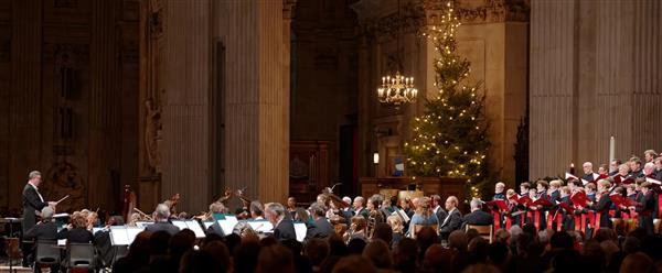 Photo of conductor and choir in front of audience in St Paul's Cathedral