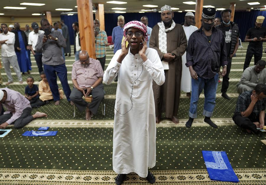 Dalha Abdi, 15, calls the adhan, or Islamic call to prayer, on Thursday, May 12, 2022, at the Abubakar As-Saddique Islamic Center in south Minneapolis.
