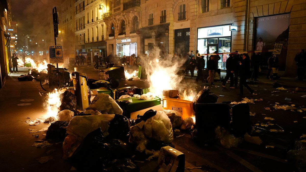 Street scene in Paris showing burning garbage everwhere.