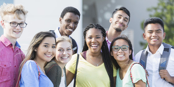 A group of smiling teenagers.