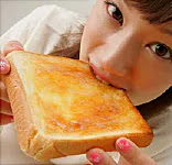 Woman Eating Buttered Toast