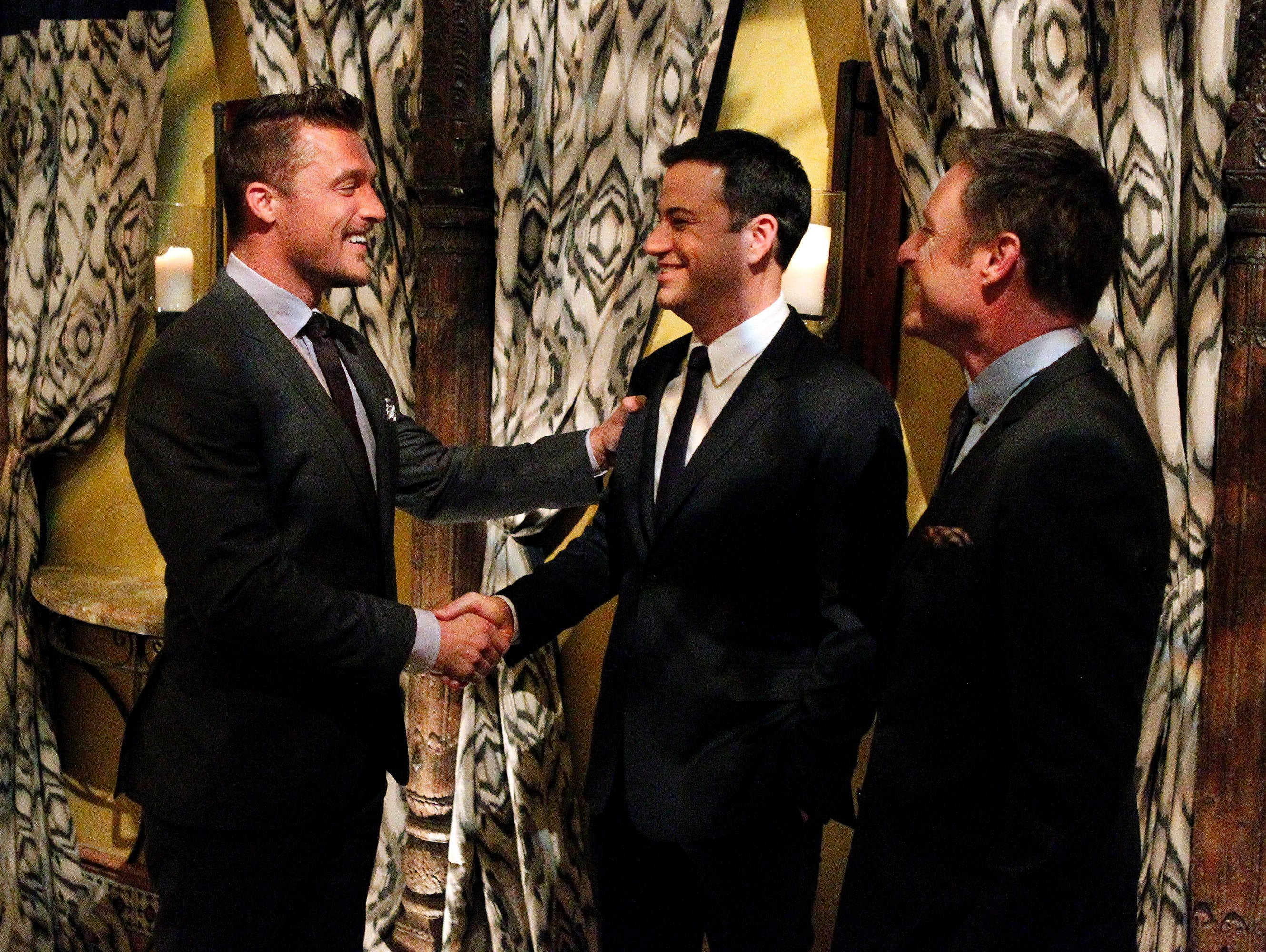 Jimmy Kimmel, center, surprises Bachelor Chris and the 18 remaining women by taking over the show as guest host for this episode in a scene from the television program 