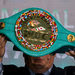 Mauricio Sulaiman, president of the World Boxing Council, shows off the title belt, which is encrusted with gold and emeralds.