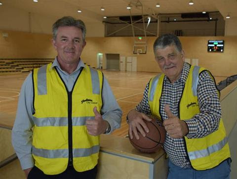 Gary George, Council Project Manager and local John Martin who both played a vital role in the development of the Indoor Sports Centre standing together and giving a thumbs up.