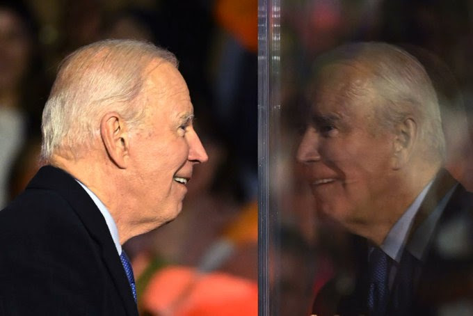 Photo of Biden seeing his reflection.