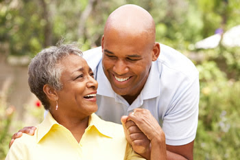 Photo: older mother hugging adult son