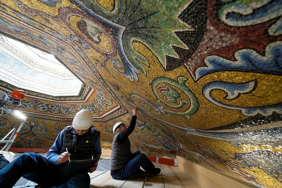 Restorers Chiara Zizola and Roberto Nardi work on the restoration of mosaics that adorn the dome of St. John's Baptistery in Florence, central Italy.