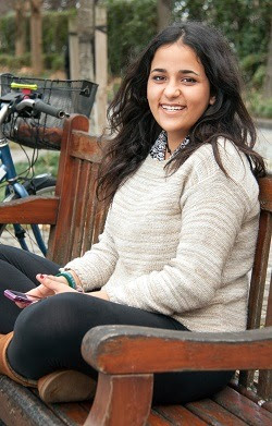 Girl on park bench with cell phone