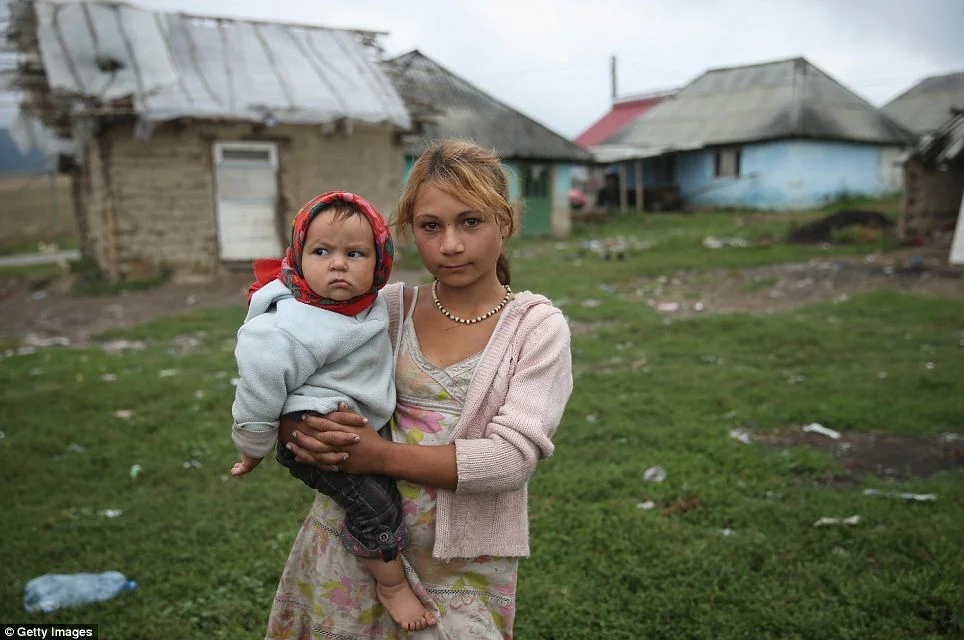 Poverty: Sorina Prodan niece in the grip of abjectly poor Roma settlement Ponorata.  Some 400-500 Roma living in the hamlet, which was all but ignored by local authorities