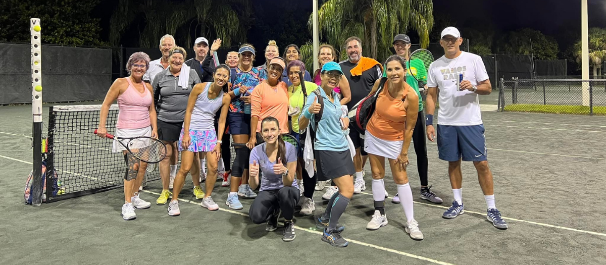 Group photo of adult tennis players at the Weston Racquet Club.