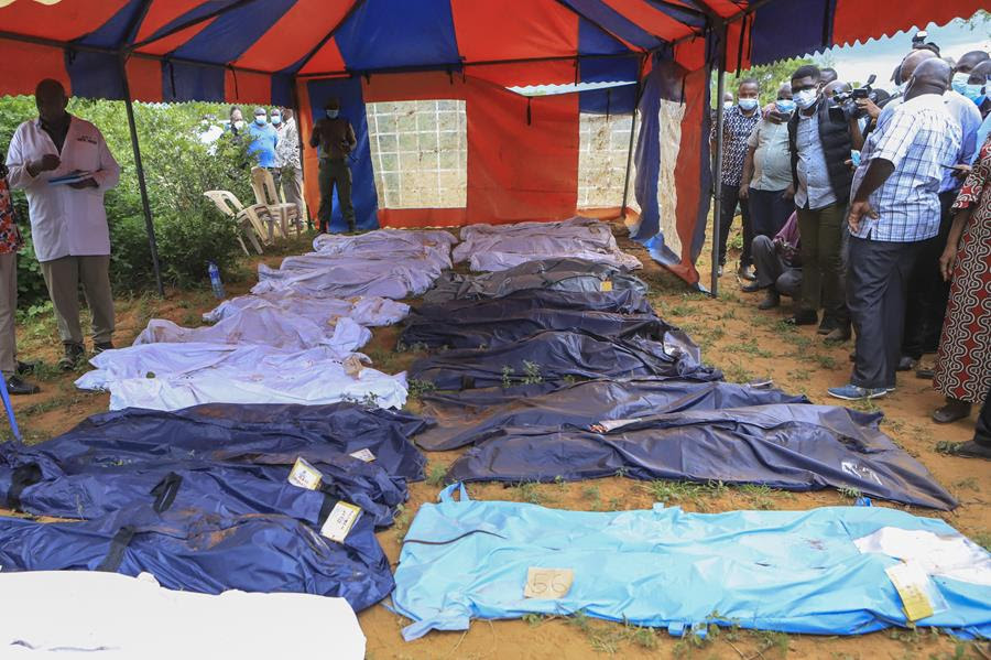 Body bags are laid out under a tent in the village of Shakahola.