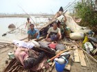 Survivors-of-2008s-Cyclone-Nargis-shelter-in-the-ruins-of-their-detroted-home-in-War-Chaum-village-Myanmar.-Credit_UNHCR_Taw-Naw-Htoo-140x105.jpg