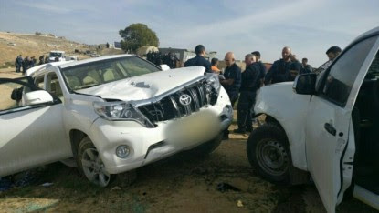 Israeli police stand next to a vehicle that rammed into police officers in the Bedouin village of Umm al-Hiran in the Negev desert, January 18, 2017. (Israel police)