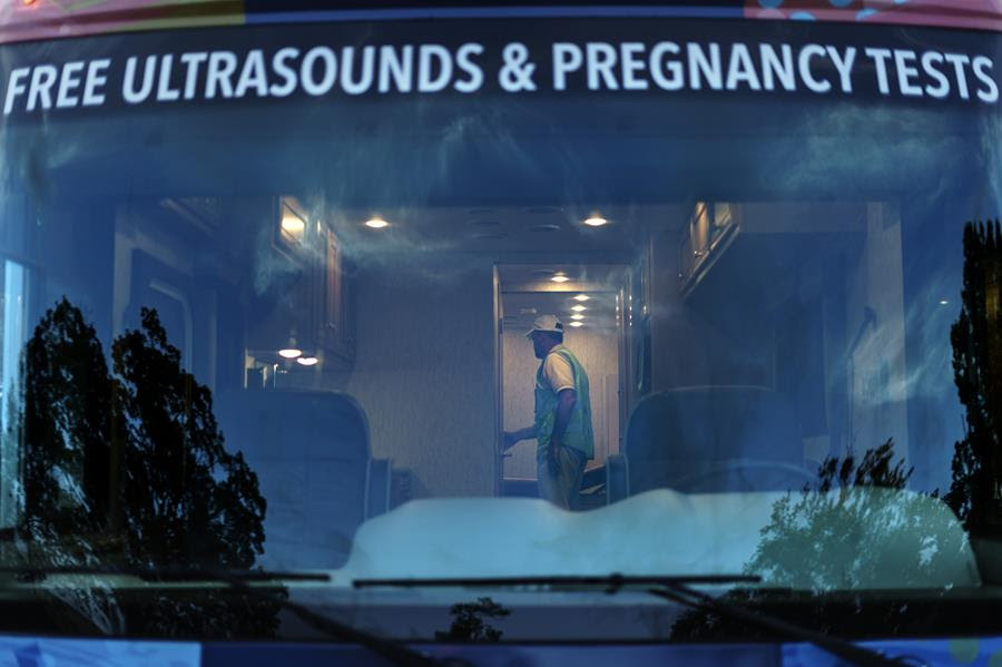 Mark Baumgartner, founder of the anti-abortion group, A Moment of Hope, arrives in an RV outfitted with any ultrasound machine outside the Planned Parenthood clinic on a day when patients will be showing up for abortion appointments.