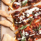 Beef Pizza with Sausages and Tahini Drizzle