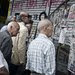 Greeks read news reports in Athens on Monday, when Prime Minister Alexis Tsipras arrived in Brussels for a eurozone meeting.