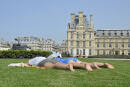 People lay on the ground as they enjoy the sun in Paris on September 11, 2020. (Photo by - / AFP)