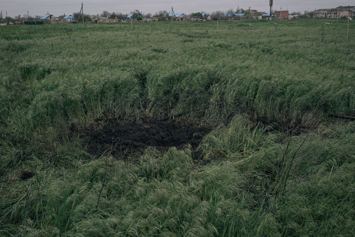 A crater where cluster munitions were detonated by a demining team.