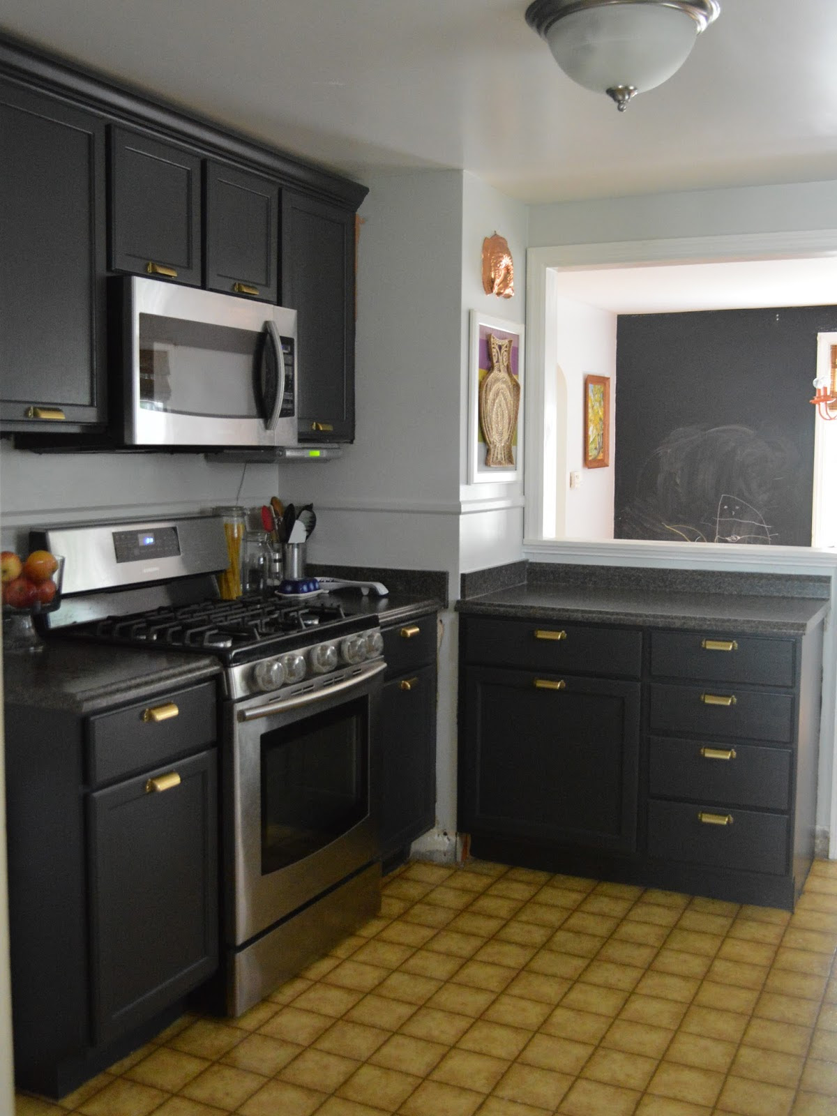 Single wall kitchen with red cabinets and black island. Black Kitchen Cabinets And Wall Color Hawk Haven