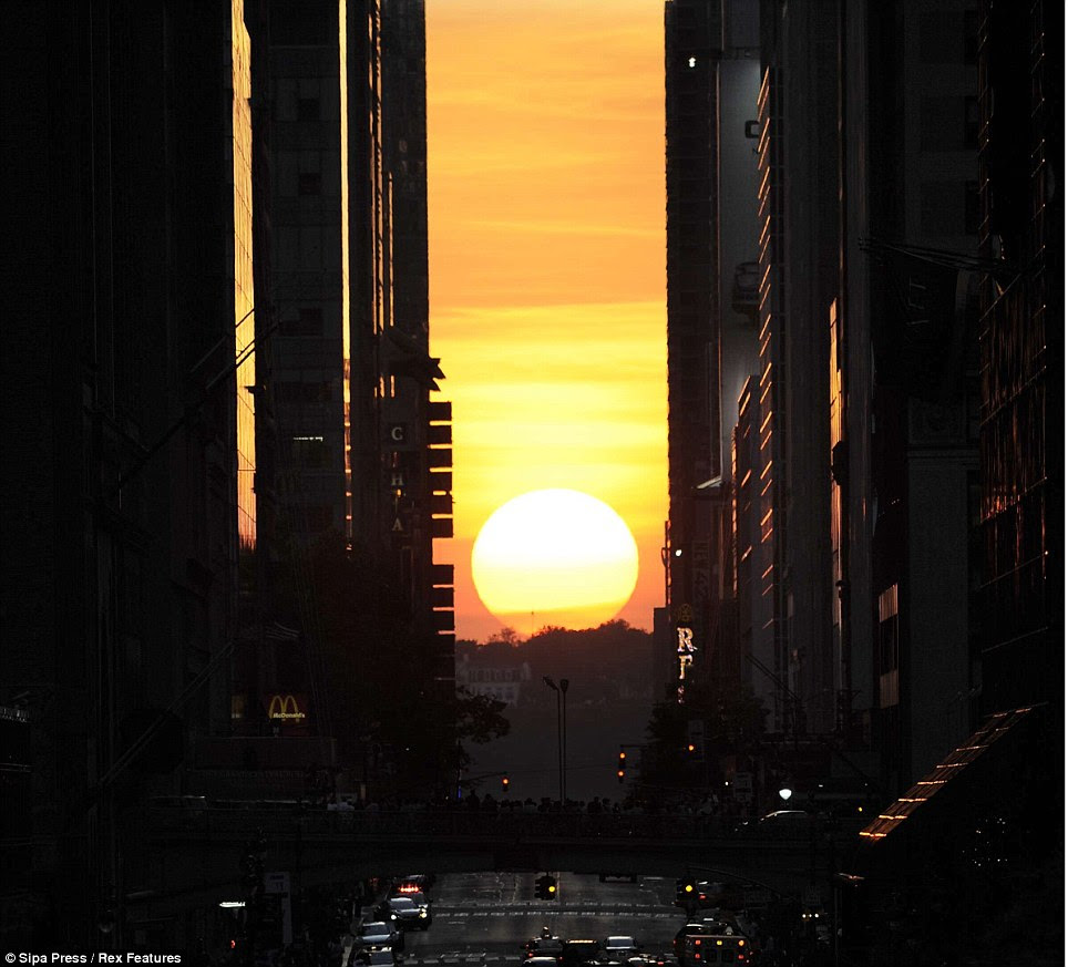 Beautiful: This occurs in Manhattan due to a clear view to the horizon beyond the grid - across the Hudson River to New Jersey - as well as the tall buildings that line the streets, creating a vertical channel to frame the sun 