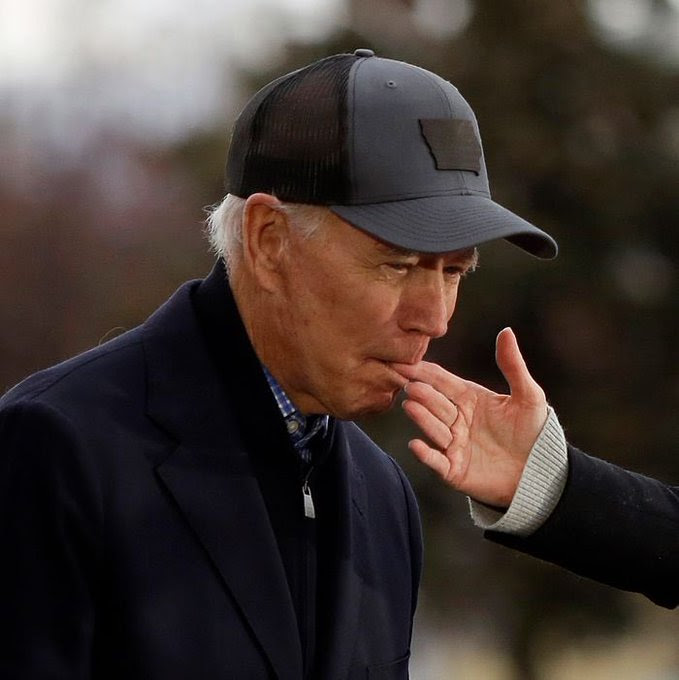 Joe Biden biting wife's finger.