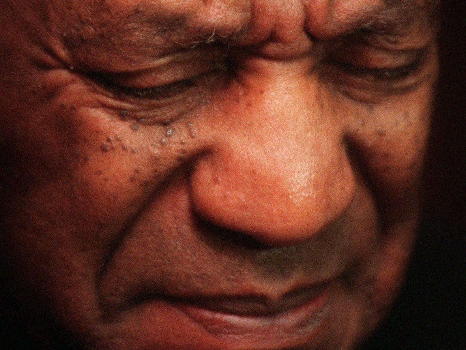 Bill Cosby reacts to a reporter's question while attending a 50th wedding anniversary party for actors Ruby Dee and Ossie Davis at a New York hotel Tuesday, Dec. 15, 1998. (AP Photo/Mark Lennihan) ORG XMIT: NYR129