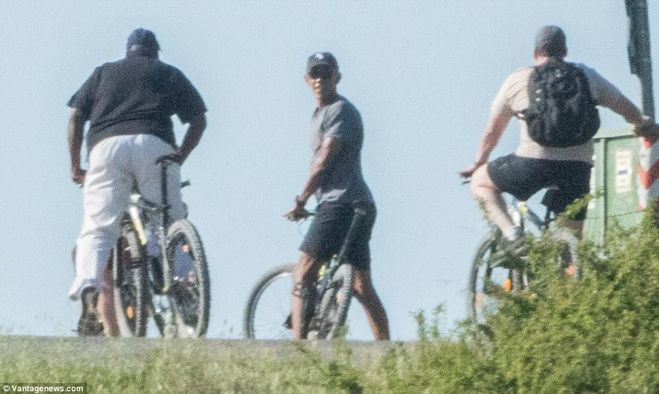 Workout: Barack was pictured enjoying a scenic bike ride along the Tuscany countryside earlier in the day on Monday