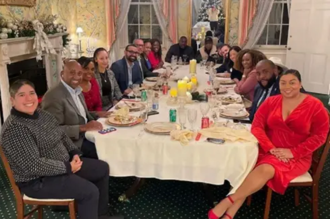 Photo of boring looking Boston Xmas party for people of color.