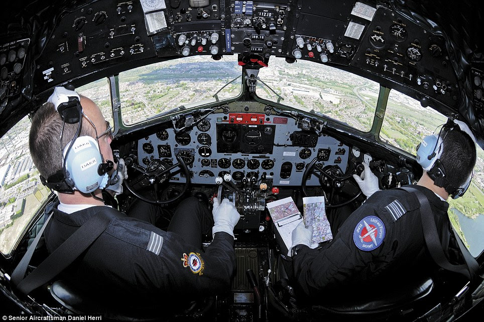 Inside view: The RAF's Battle Of Britain Memorial Flight team take flight in their Dakota aircraft, to perform a flypast over the RAF Museum in Hendon, north-west London