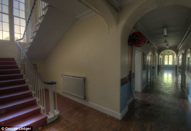 Grand interior: The hall boasts a library with dummy bookshelf, many original staircases and fireplaces - but needs major repairs