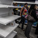 Many store shelves lie bare in Venezuela, and people wait in line for hours to buy basics.