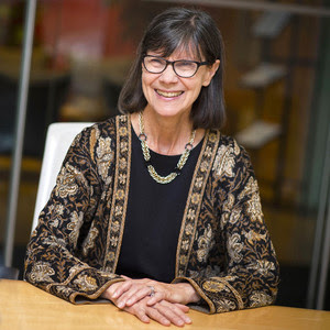 dr langevin at desk smiling