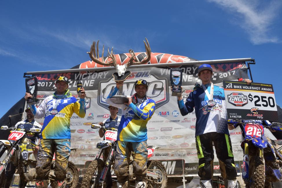 Thad Duvall (center) earned his first win of 2017 at the inaugural X-Factor GNCC. Josh Strang (left) and Ricky Russell (right) rounded out the top three overall.