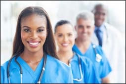 The figure above is a photograph showing a group of health care workers.