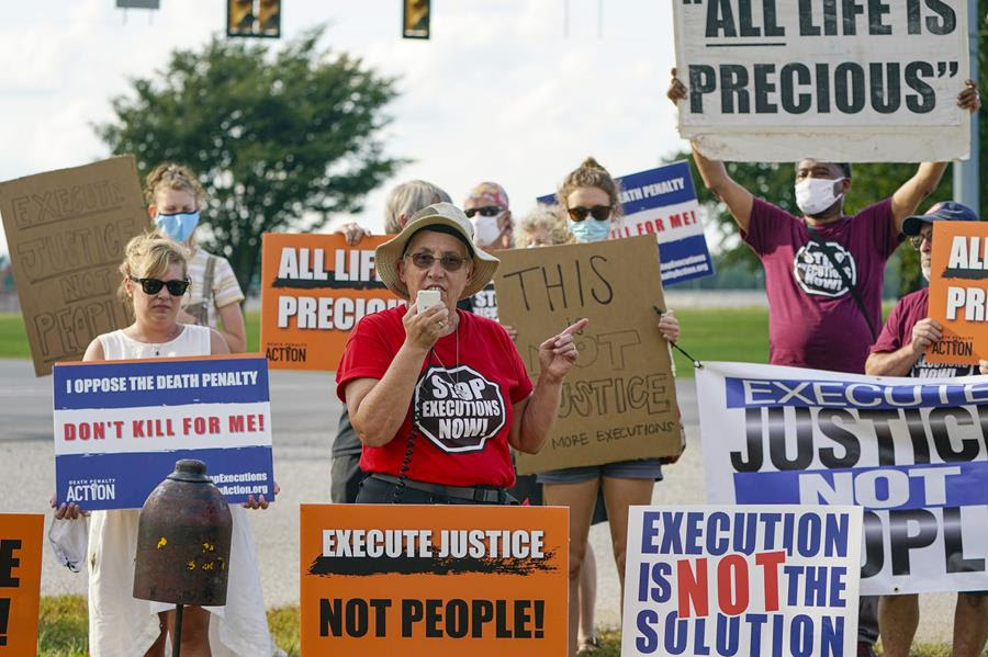 In this Wednesday, Aug. 26, 2020, file photo, Sister Barbara Battista speaks during a protest against the death penalty, across the street from the federal prison complex in Terre Haute, Ind., before the execution of Lezmond Mitchell, the only Native American on federal death row. (AP Photo/Michael Conroy, File)