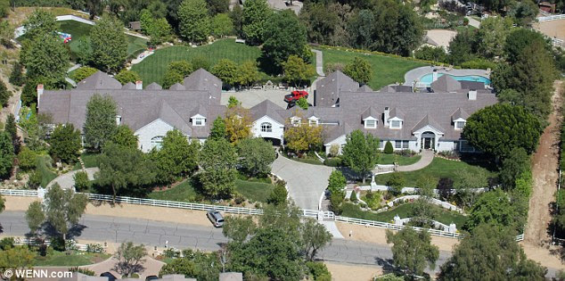 Jennifer Lopez's former Bel-Air home included an arched footbridge and a cobblestone driveway cross a stone-lined waterway that encircled the villa