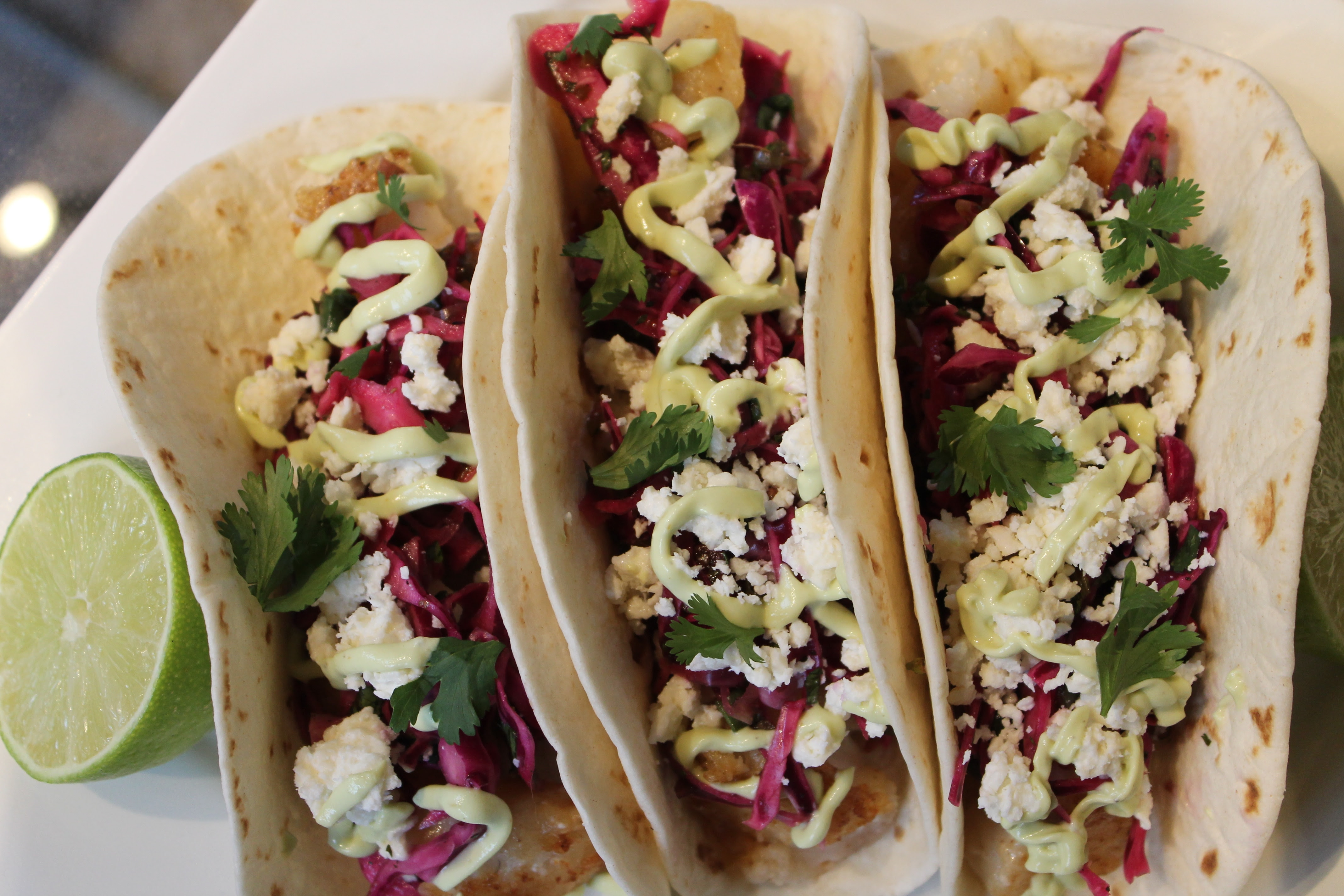 It's super easy to throw together: Beer Battered Fish Tacos With Cilantro Lime Red Cabbage Slaw Avocado Crema And Cotija Cheese Spices In My Dna