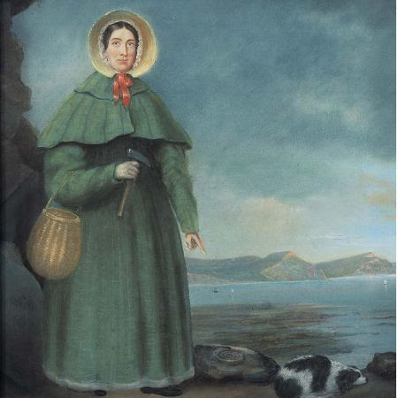 A painting of Mary Anning, with brown hair covered by a bonnet, wearing a long blue overcoat and carrying a basket.