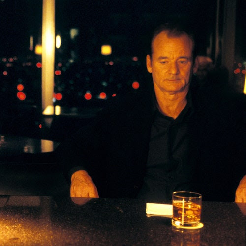 Still from "Lost in Translation" of Scarlett Johansson and Bill Murray at a bar counter.