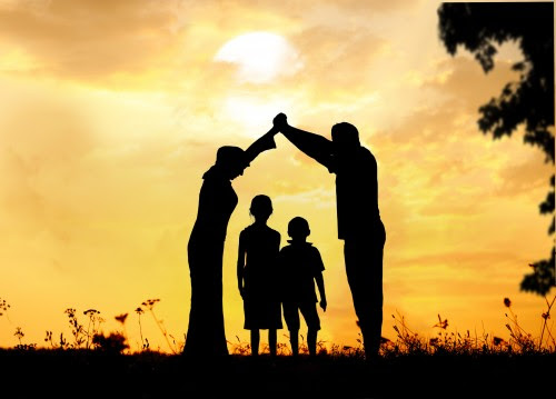 Happy parents making home for kids in beautiful nature